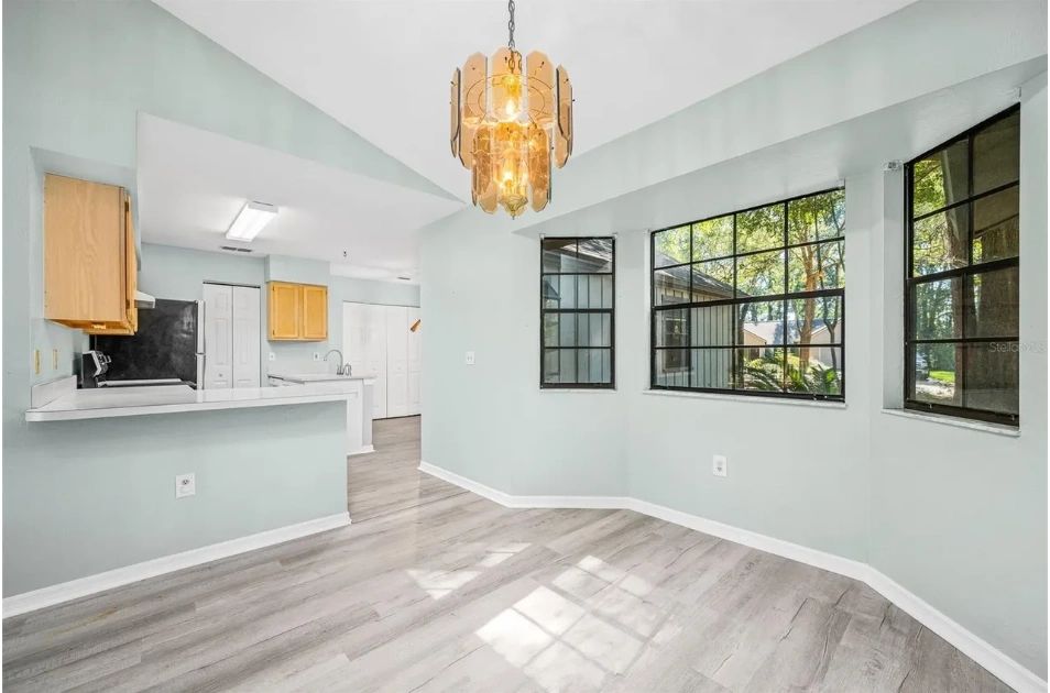Mint-green kitchen walls inside the L-shaped ranch home in Gainesville