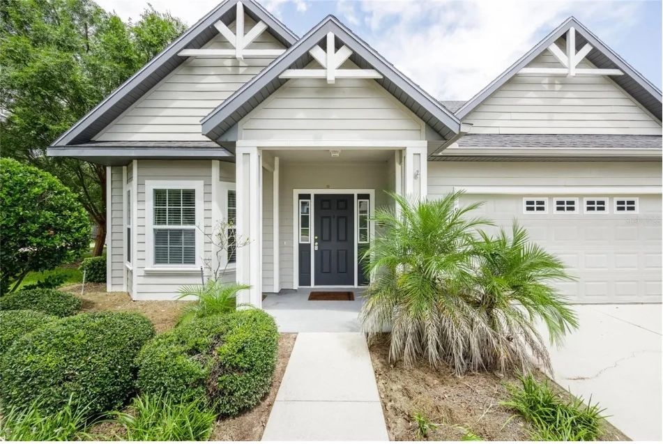 Gray craftsman home in Gainesville with a triple-gable roofline, exterior view